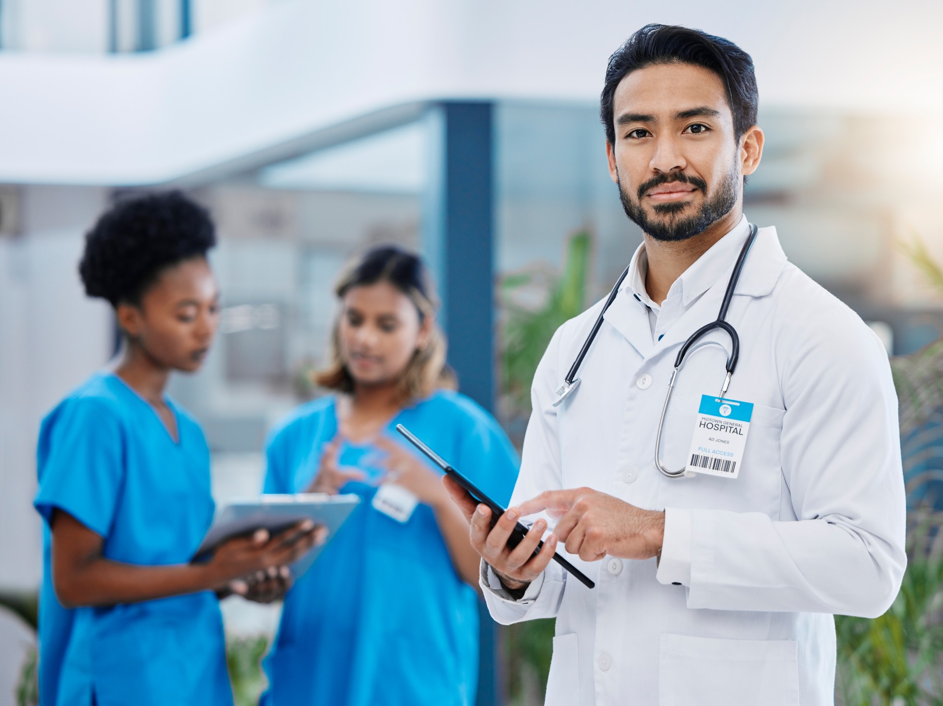 Doctor tablet, hospital team and man portrait with nursing vision in clinic. Healthcare, wellness and professional group with nurse staff and stethoscope ready for medical teamwork and support